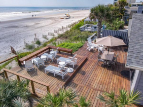 Beachfront Deck with steps down to the white sandy beach Sea Dunes Sandcastle 1A
